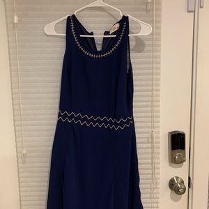 Medium length blue and gold dress.
